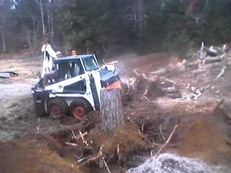 Digging Stumps w/709 Backhoe Attachment 